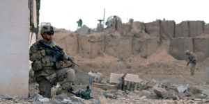 US soldiers inspect the scene of a suicide attack outside a base in Zhari district, Kandahar province on January 20, 2014. Nine Taliban militants launched a suicide assault against a US base in southern Afghanistan on January 20, killing one NATO soldier in a region where foreign troops are rapidly pulling out, officials said. AFP PHOTO/Javed Tanveer (Photo credit should read JAVED TANVEER/AFP/Getty Images)